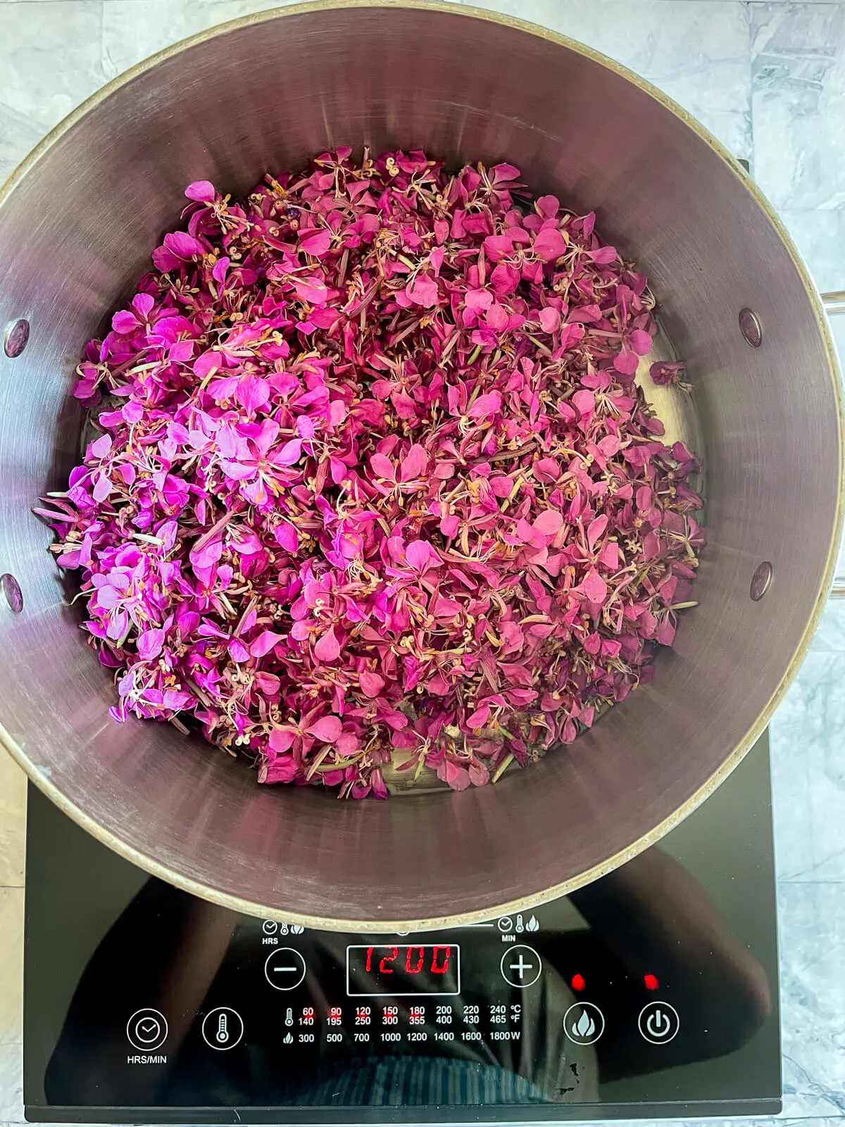 Pink willowherb flowers in a saucepan. 