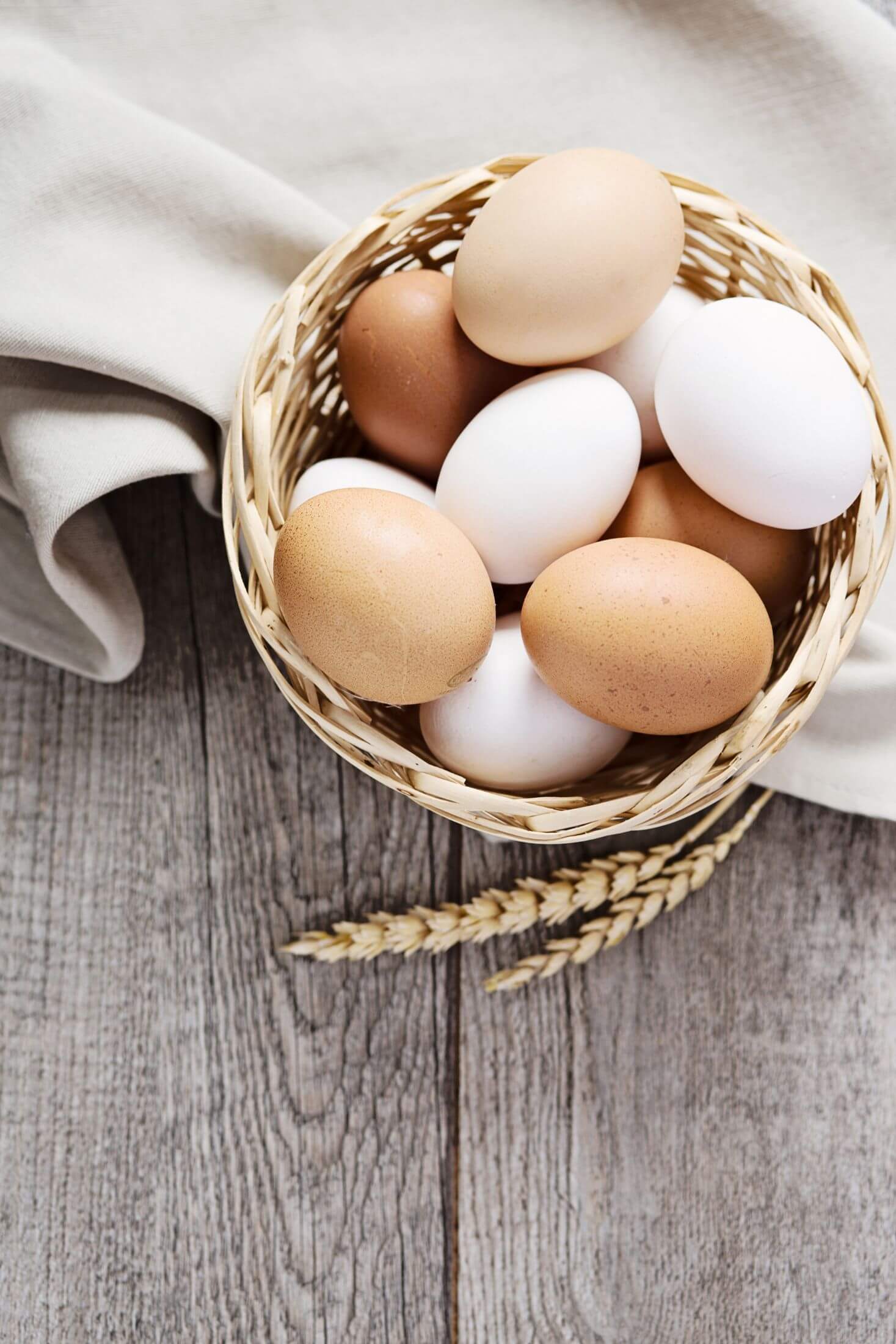 Brown and white eggs in a basket. 