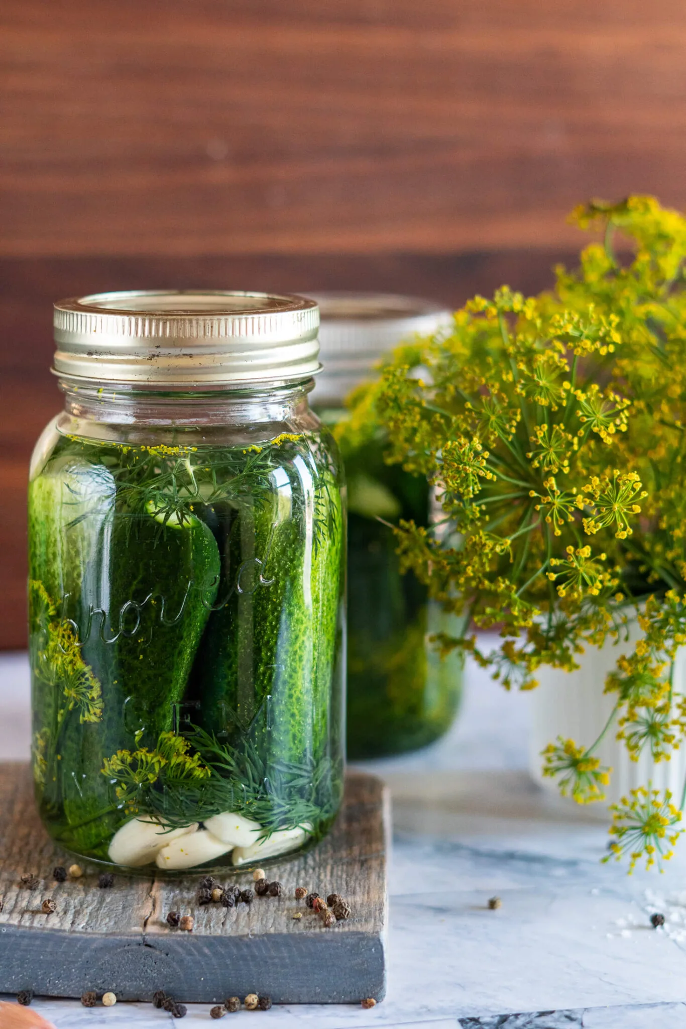 Half sour pickles in vintage jars. 