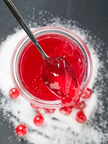 Jar of pin cherry jelly.