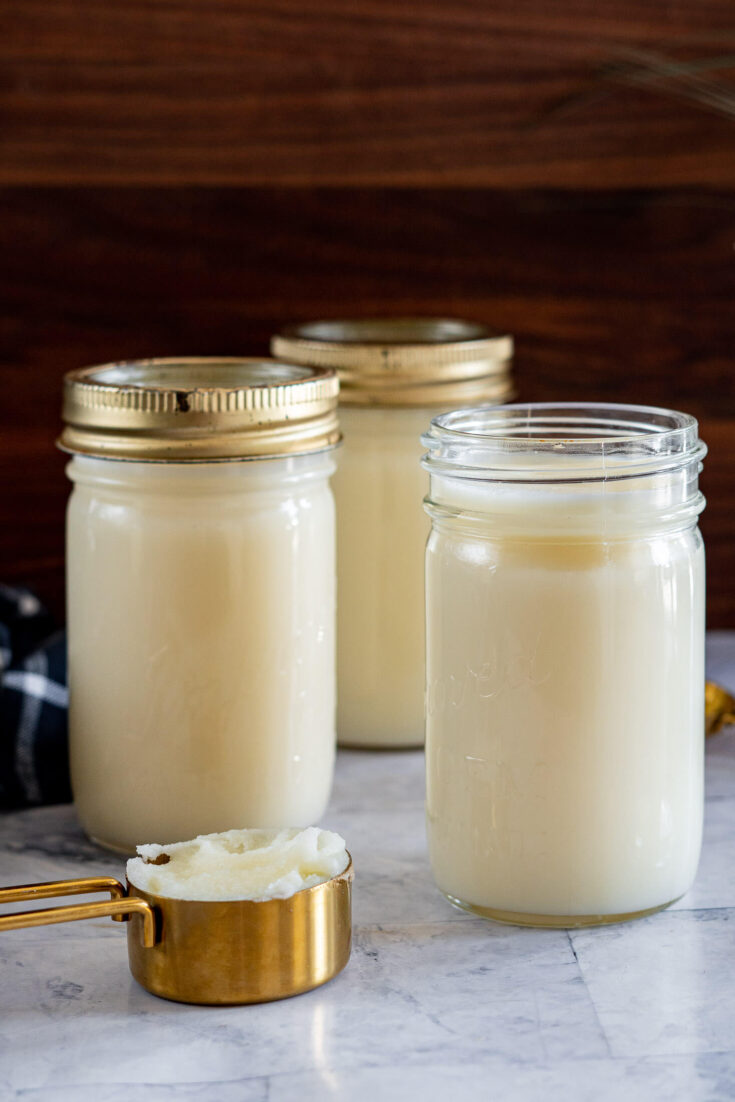 Fresh rendered beef tallow in mason jars.