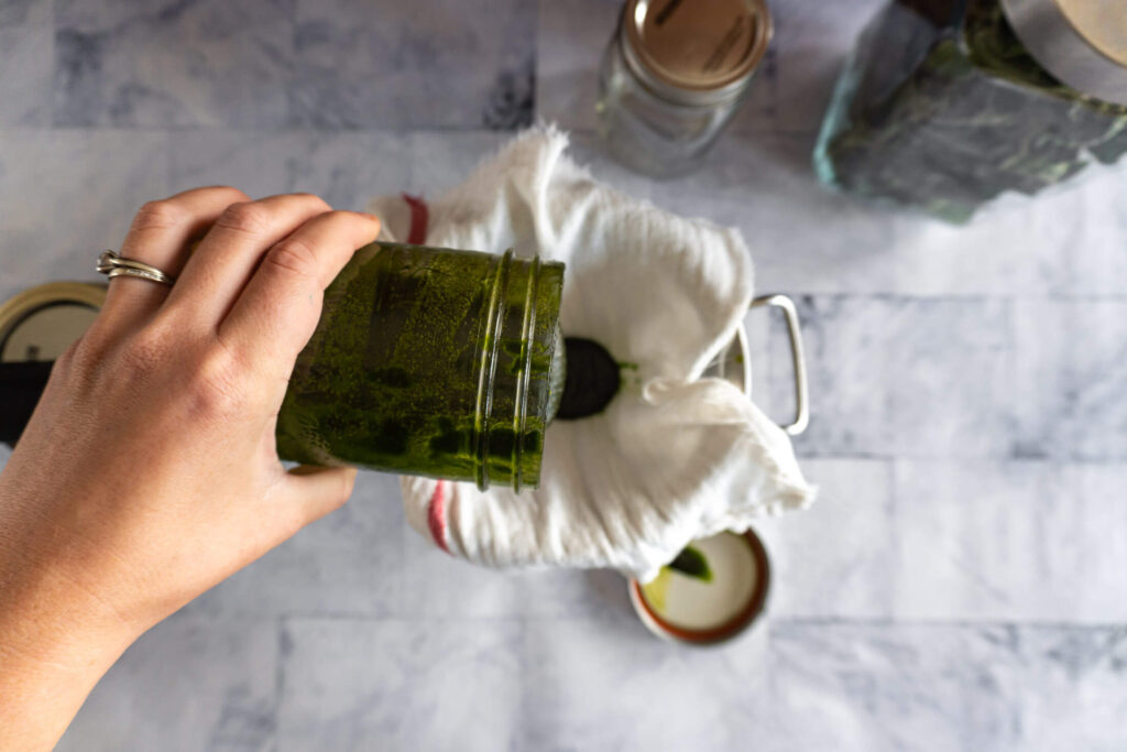 Straining solids out of infused oil. 