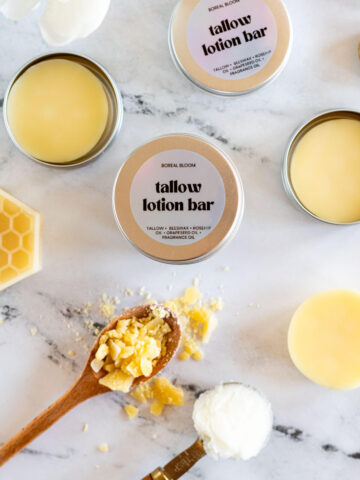Tallow lotion bars in a metal tin.