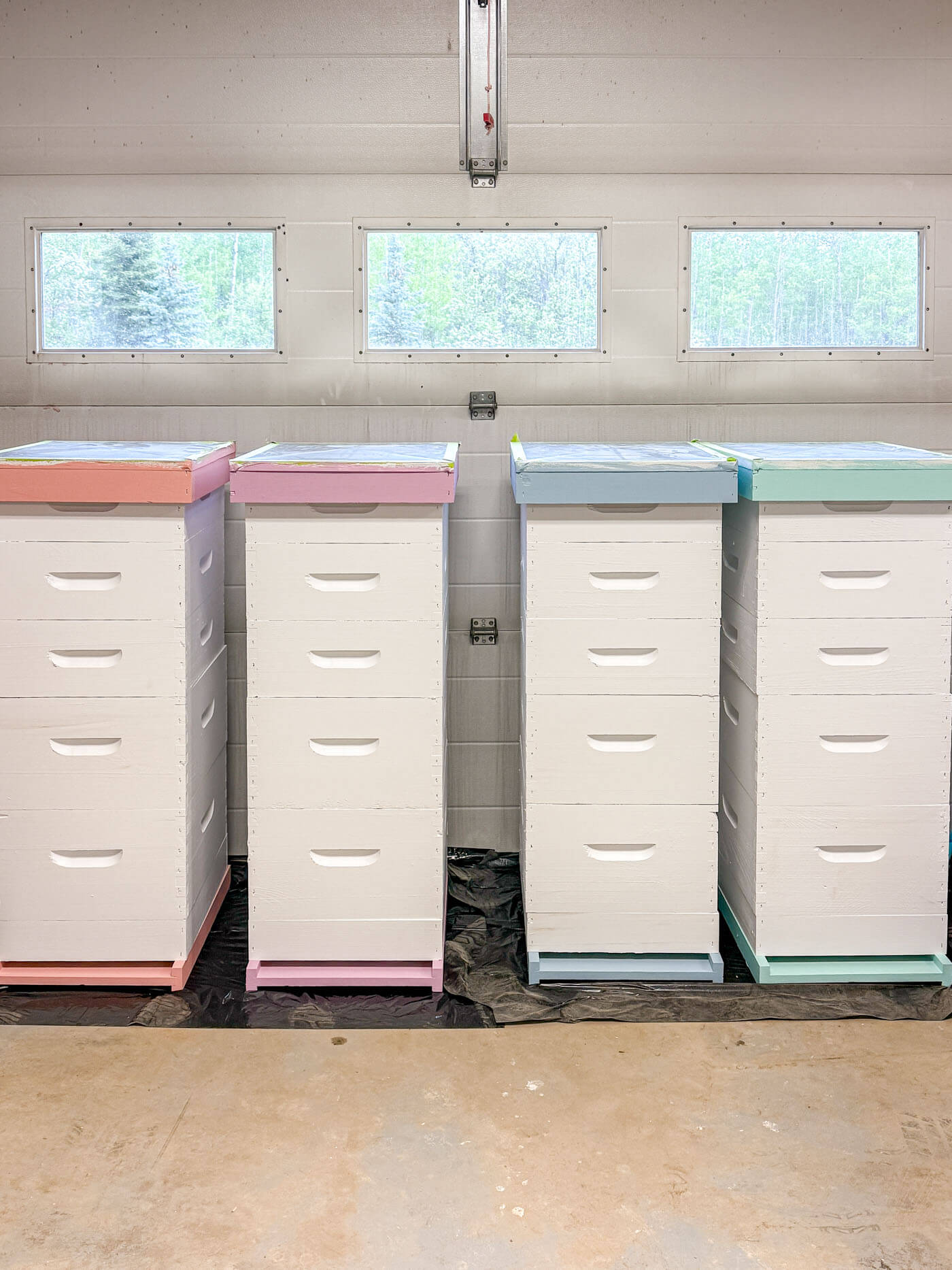 Painted hive boxes curing.