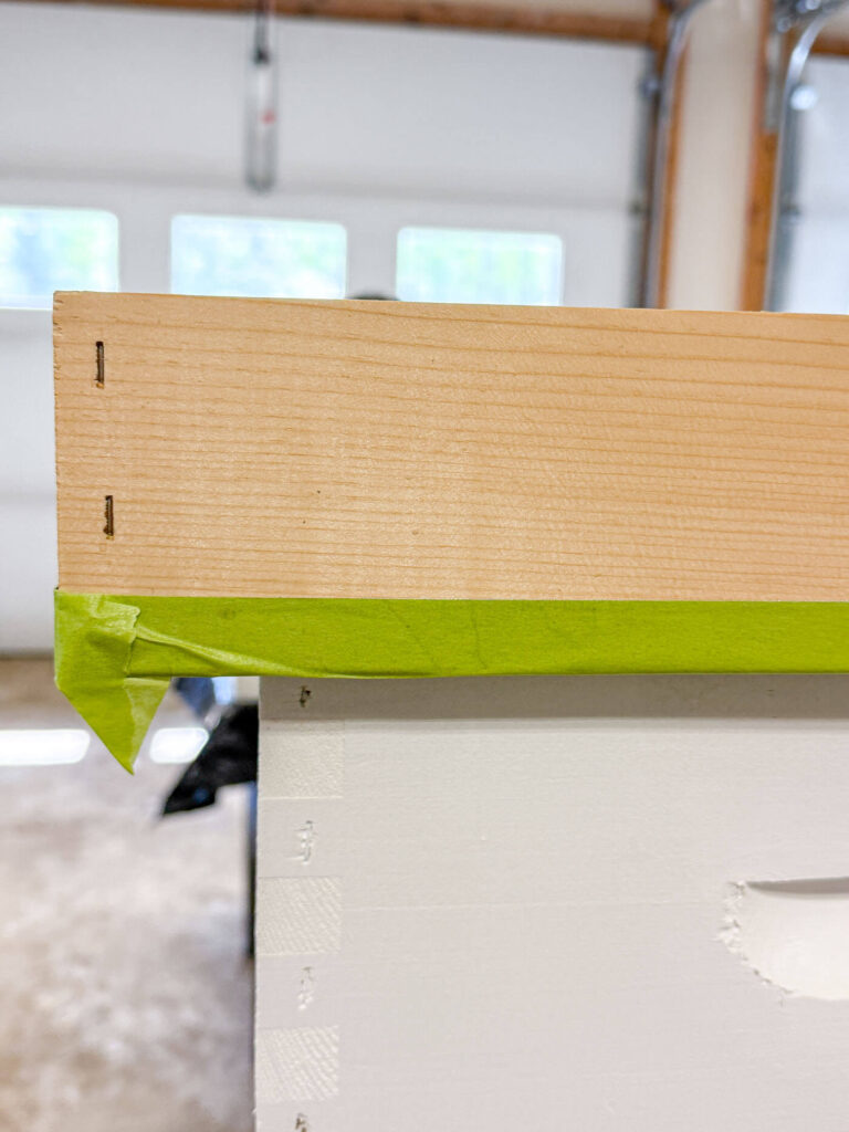 Taping off the metal portion of the telescopig lid.